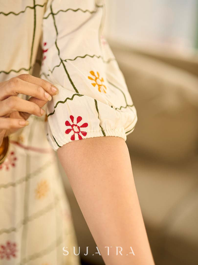 Soft off-white block printed rayon dress with intricate all-over hand block printed checks and florals, a gently gathered yoke, and rich red accents for a refined, elegant everyday look.