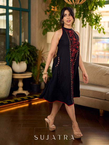 Black bias-cut block print halter dress with a red jaal hand block printed front panel, golden print detailing, and red accents for a striking, elegant statement look.