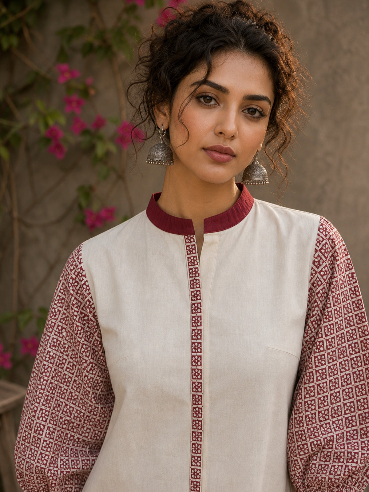 Chic off-white top featuring intricate hand block print sleeves in a vibrant red, complemented by a matching central decorative trim. - Pant Optional