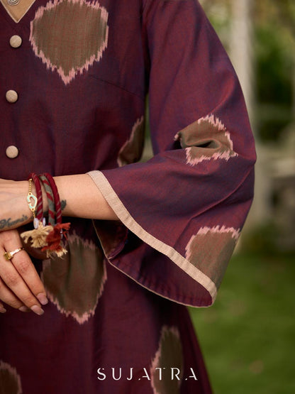 Elegant wine-purple Ikat dress with flowy sleeves, finished with a belt for a softly cinched silhouette.