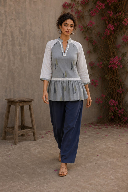 Soft blue Jaipur hairline stripe top featuring Hakoba raglan sleeves and a flattering gathered waist silhouette.