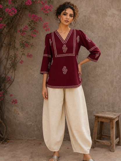 Graceful maroon hand block print top featuring timeless paisley motifs, delicate borders, and an elegant V-neck silhouette, crafted for effortless everyday sophistication.