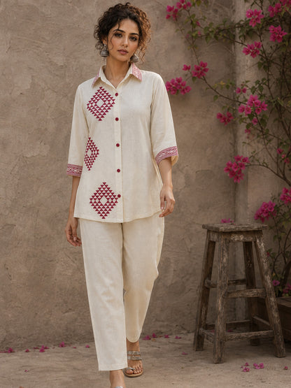 Vibrant ivory hand block print shirt featuring geometric motifs, magenta accents, and a contemporary silhouette inspired by traditional craftsmanship.