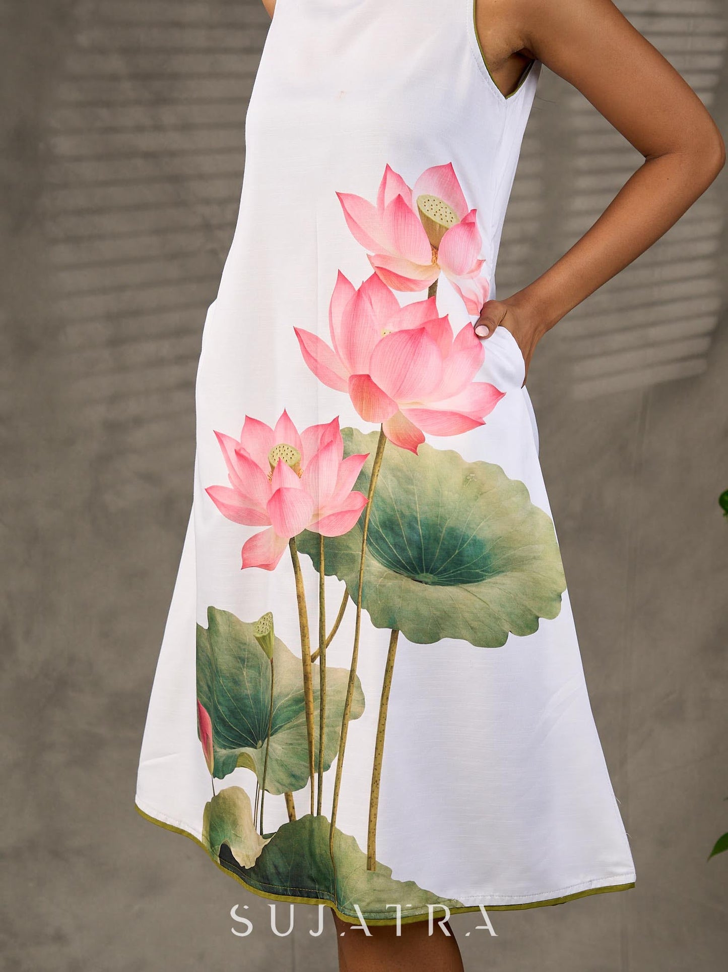 Graceful White lotus printed dress with elegant olive accents.