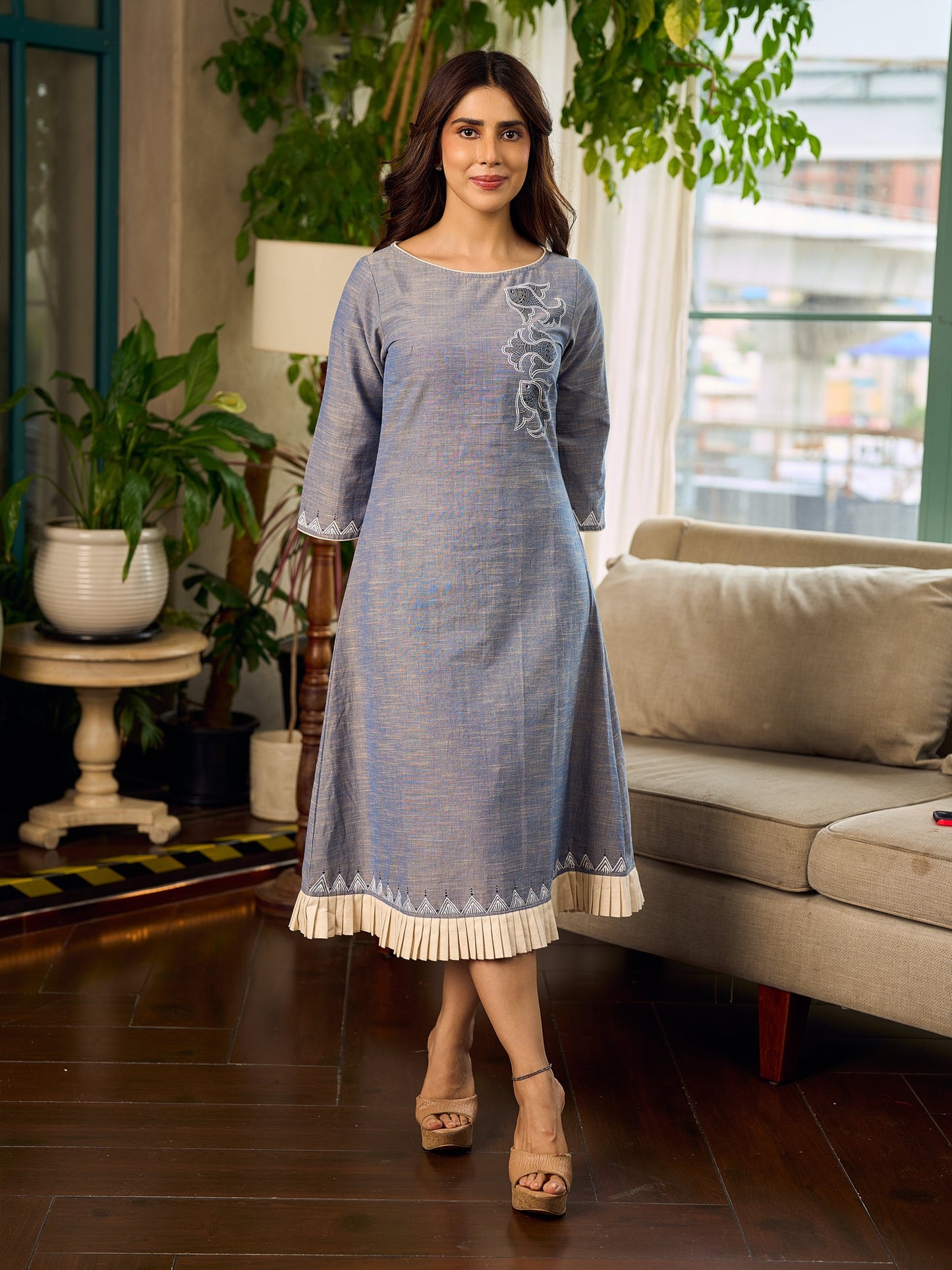 Two-tone handloom cotton dress with delicately painted Madhubani fish motifs and pleated hem.