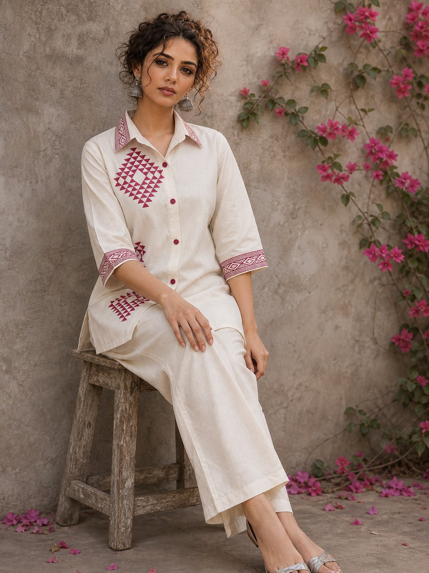 Vibrant ivory hand block print shirt featuring geometric motifs, magenta accents, and a contemporary silhouette inspired by traditional craftsmanship.