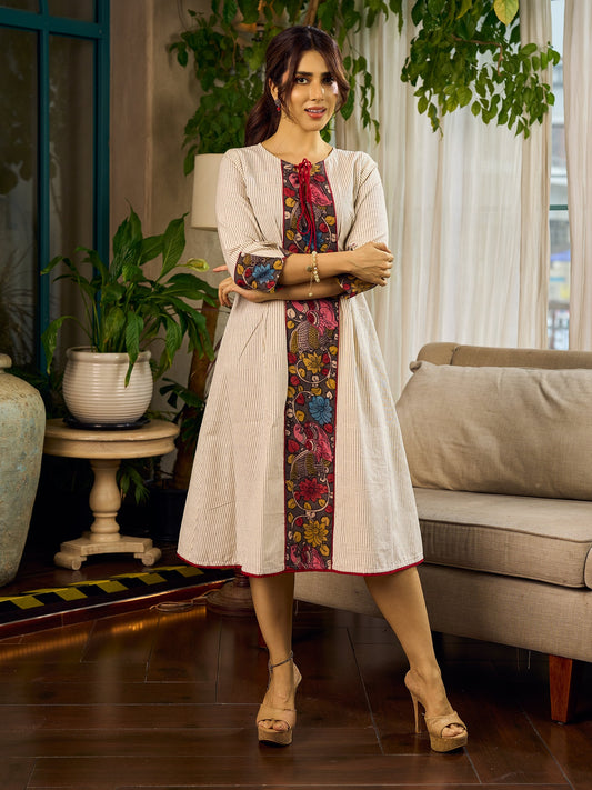 White and black striped dress with Kalamkari panel and tie-up neckline.
