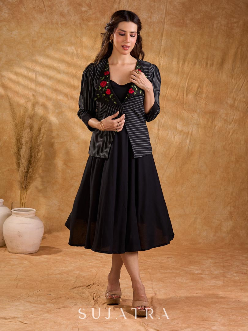 Exquisite black Ikat jacket with offset collar flaps and detailed red floral vine embroidery, delivering a sculpted, high-impact silhouette with refined presence for corporate styling.