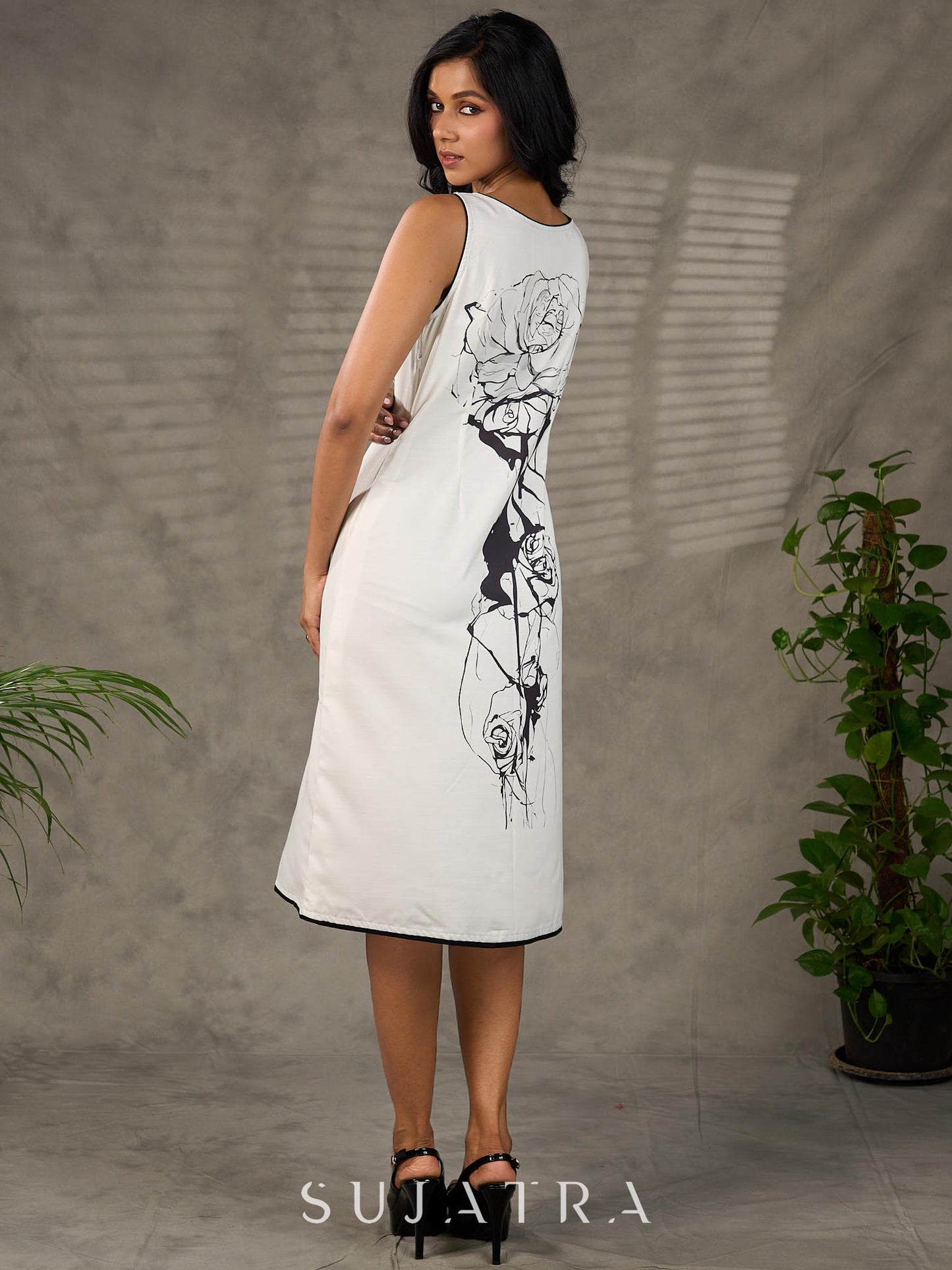 Timeless monochrome dress with statement flower print.