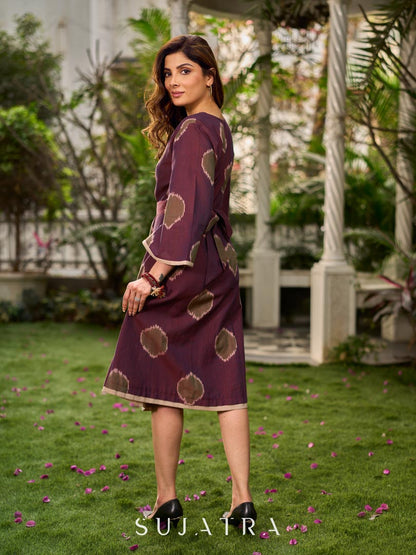 Elegant wine-purple Ikat dress with flowy sleeves, finished with a belt for a softly cinched silhouette.