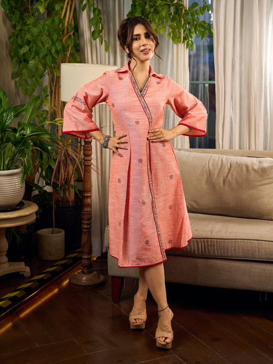 Peach dress featuring delicate Madhubani painting and graceful flared sleeves.