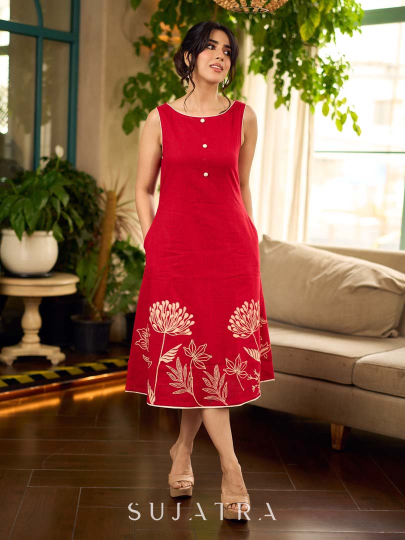Vibrant red sleeveless dress with a bold off-white floral hand block print at the hem and clean off-white edging for a striking, handcrafted-inspired finish.