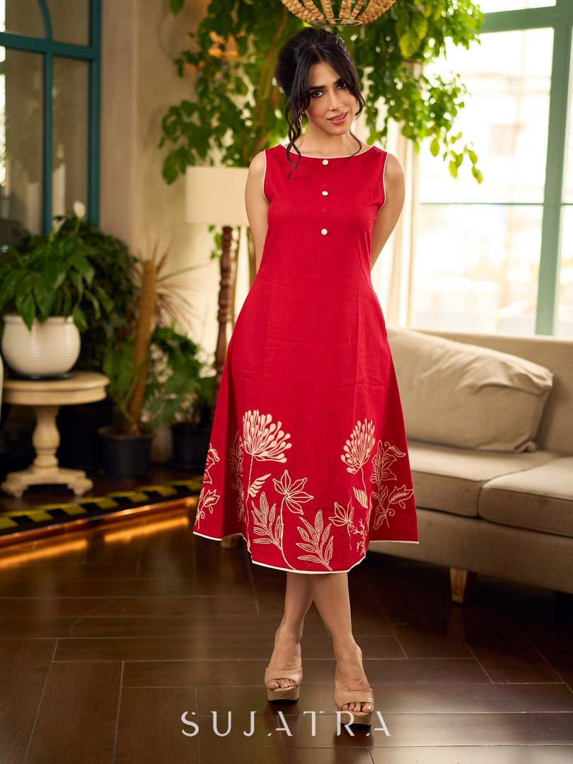 Vibrant red sleeveless dress with a bold off-white floral hand block print at the hem and clean off-white edging for a striking, handcrafted-inspired finish.