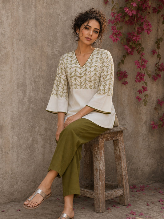 Contemporary off white and olive hand block print top features subtle geometric motifs, airy bell sleeves, and effortless elegance for versatile everyday styling.