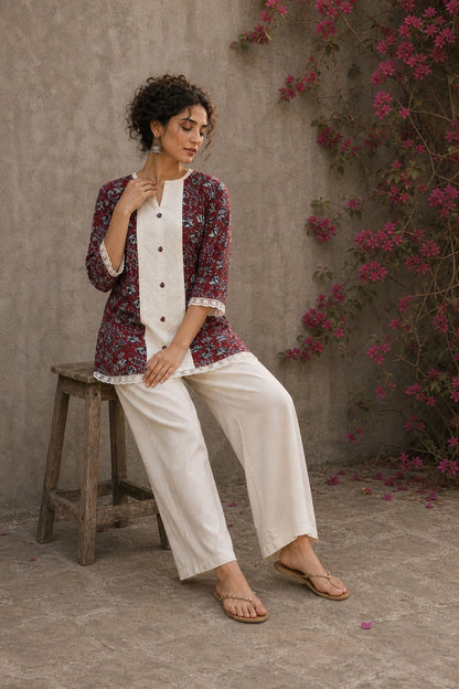 Deep red Jaipur floral printed top featuring maroon pintuck yoke, off-white panel, and scalloped lace detailing.