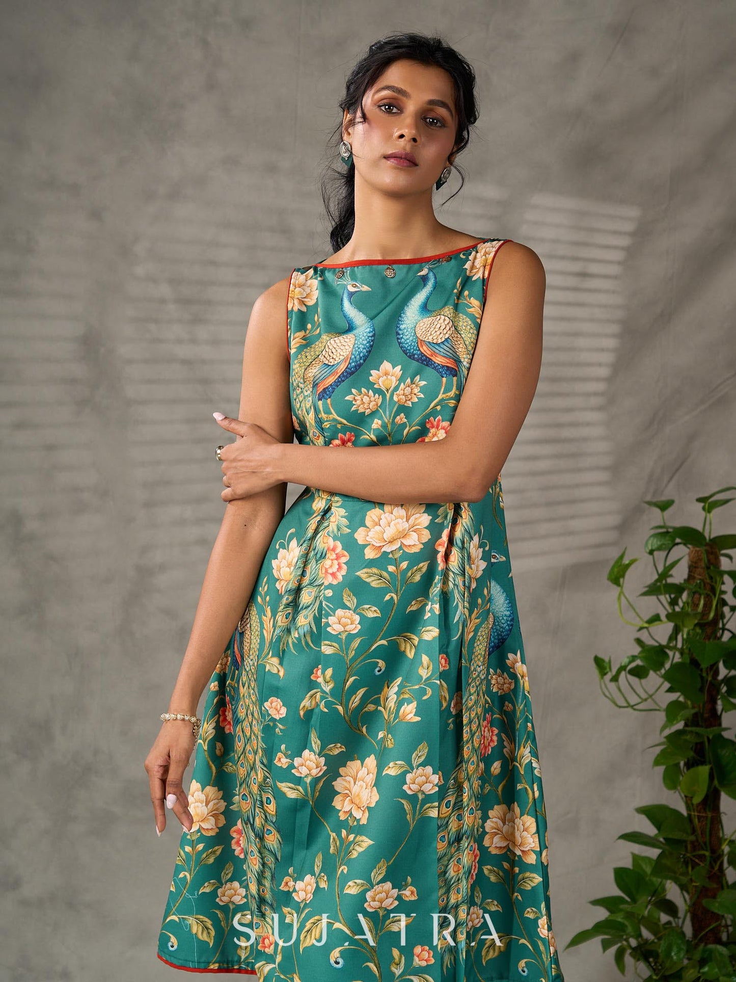 Green peacock motif printed dress with straight neckline and orange accents