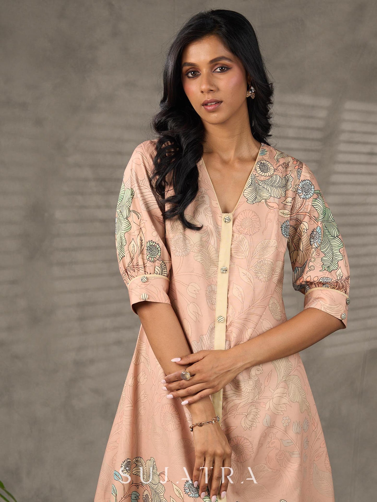 Peach Kalamkari-inspired shirt dress with soft beige accents.