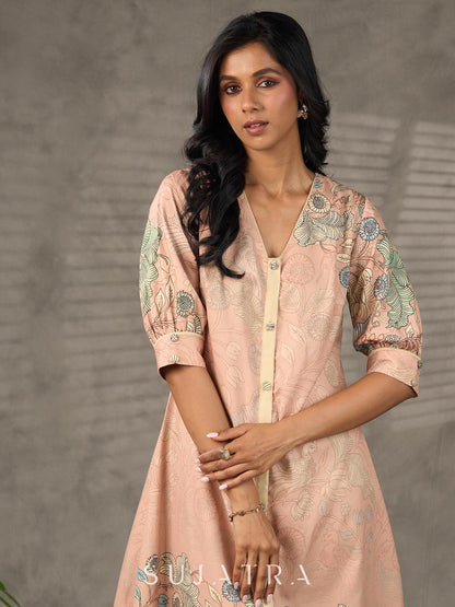 Peach Kalamkari-inspired shirt dress with soft beige accents.