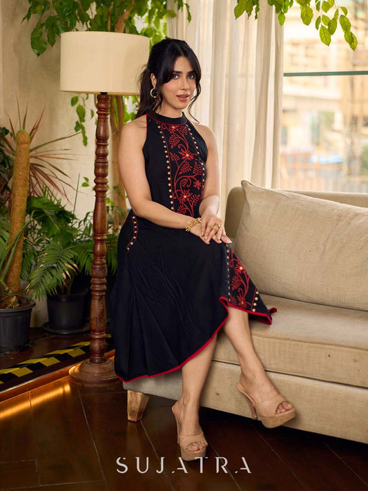 Black bias-cut block print halter dress with a red jaal hand block printed front panel, golden print detailing, and red accents for a striking, elegant statement look.
