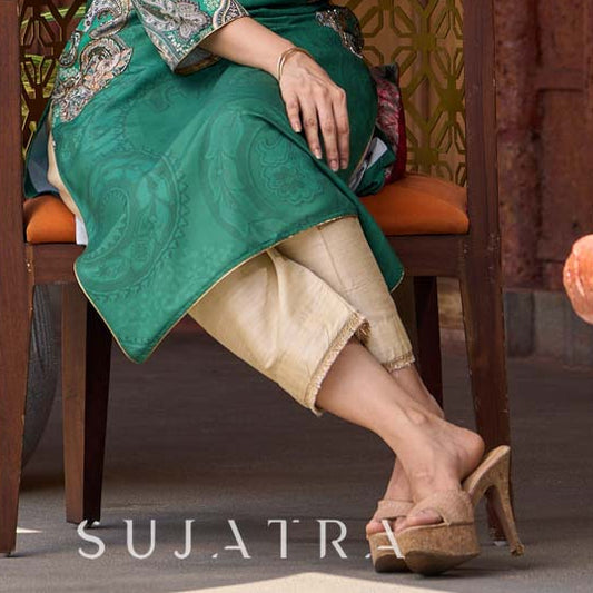 Graceful cream cotton-silk pants finished with soft tassel lace.