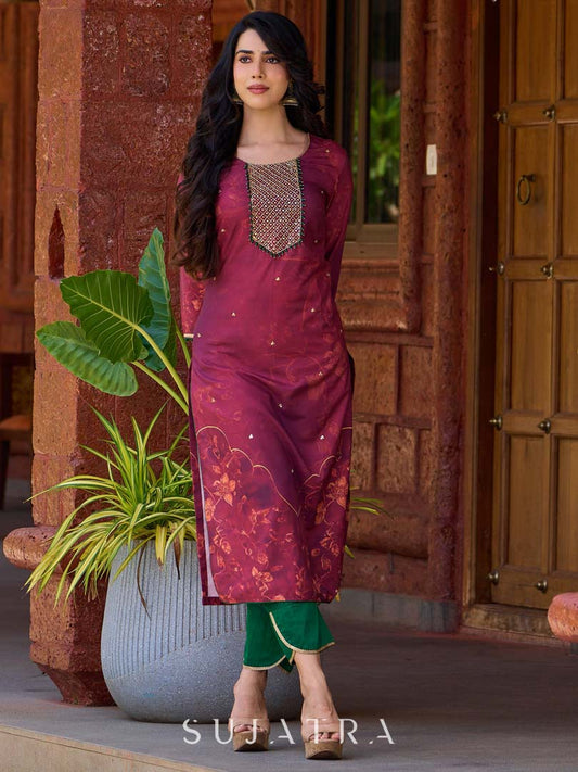Exquisite deep burgundy printed kurta with intricate neck panel embroidery, delicate green beads, and refined green highlights.