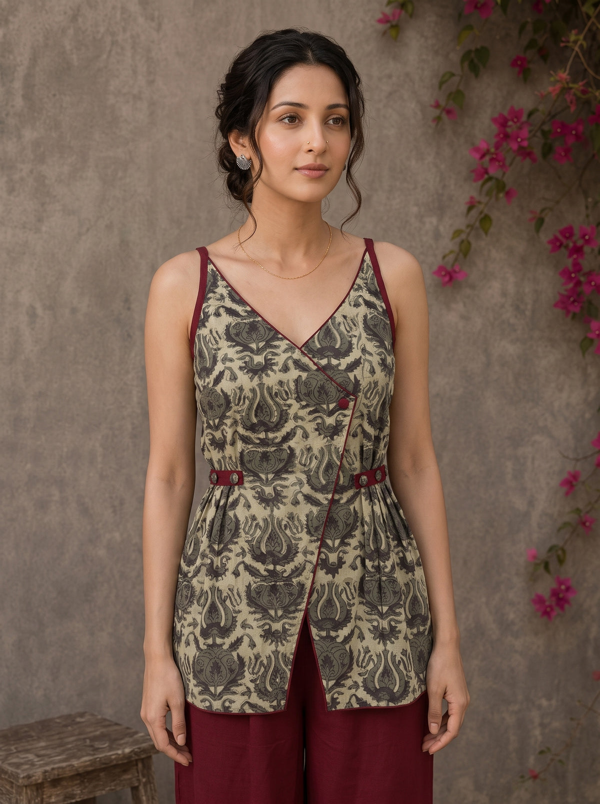 Rustic olive and maroon vegetable-dyed printed top with crossover styling and rich maroon accent detailing.
