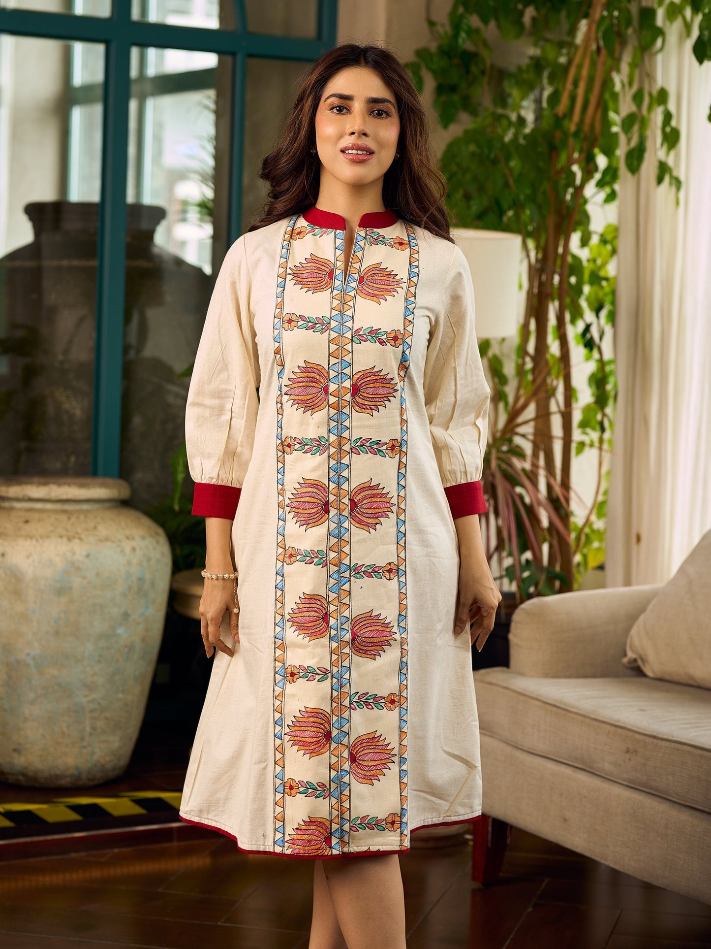 Artisan-crafted off-white Madhubani dress with beautiful hand-painted motifs and trim.