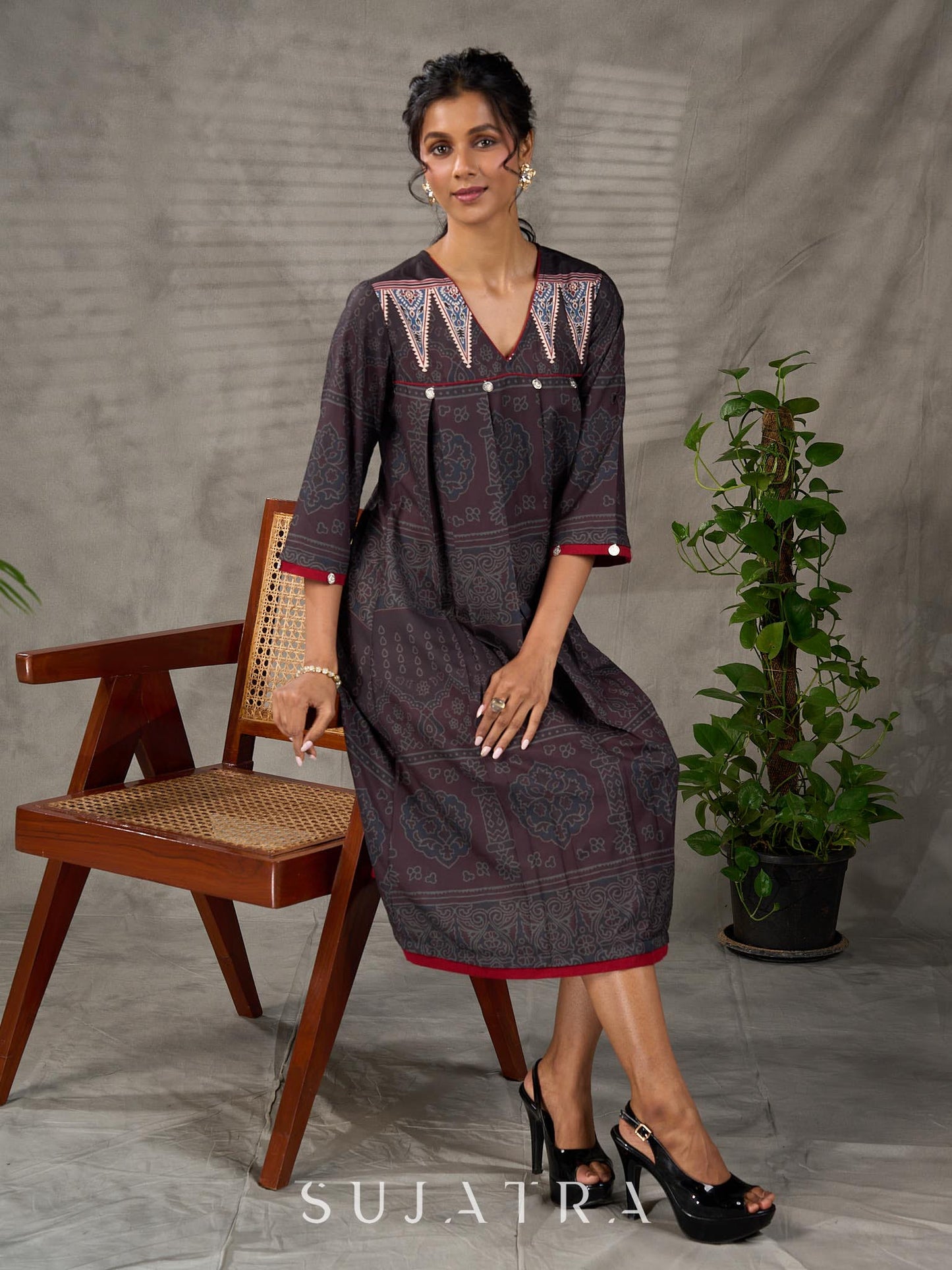 Black Ajrakh printed dress with pleats, maroon accents, and silver embellishments.