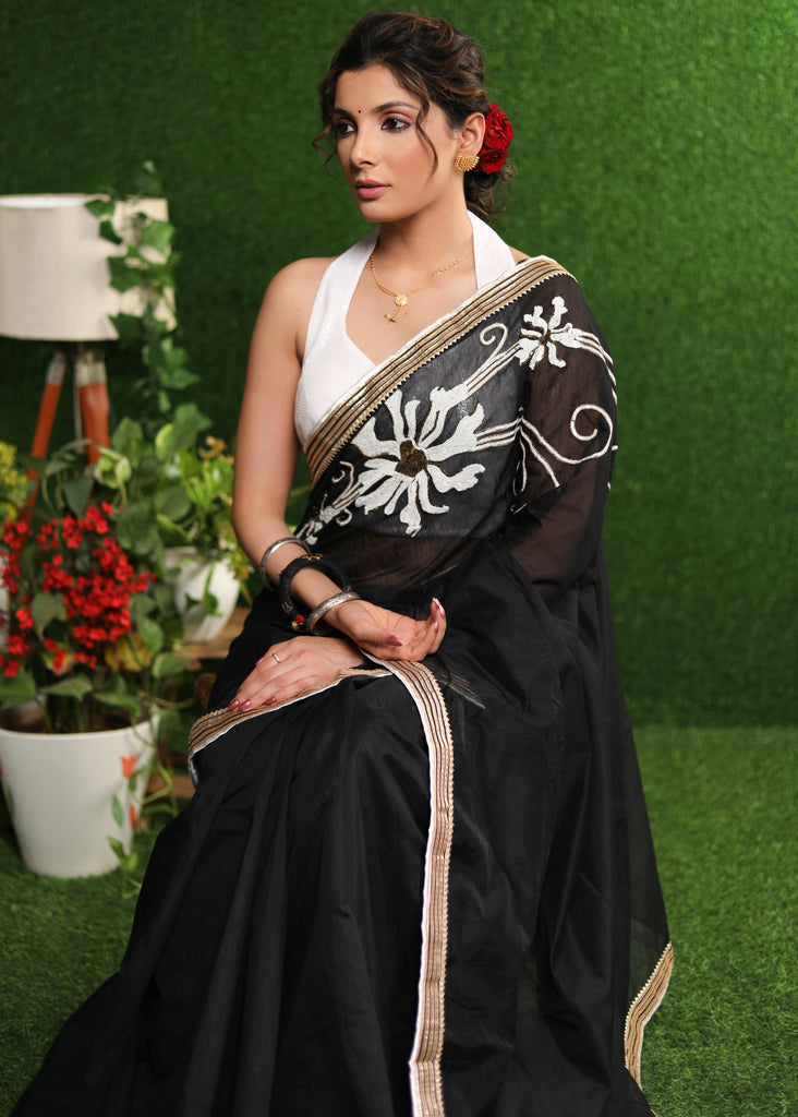 Serene black Chanderi saree with elegant handwork & border