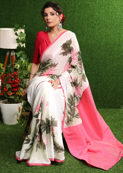 Beautiful white chiffon saree with pink hand painted floral motif & pink border