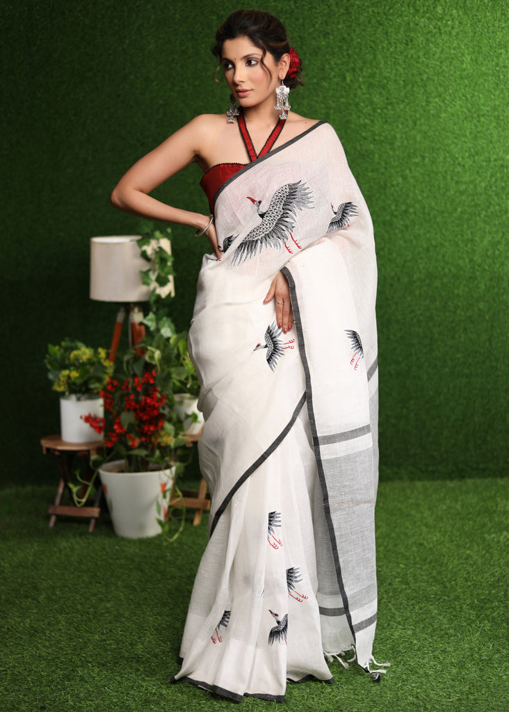Regal white Linen saree with designer flamingo handwork