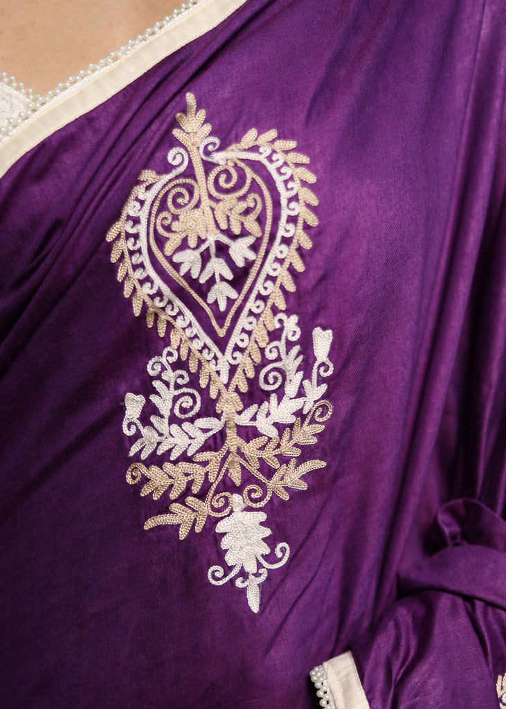 Elegant purple cotton Silk saree with beige embroidery motifs.