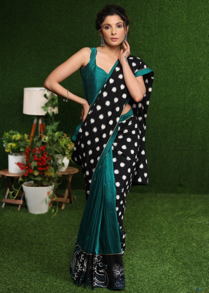 Exquisite black double Ikat & turquoise combination saree with hand painted Gond border
