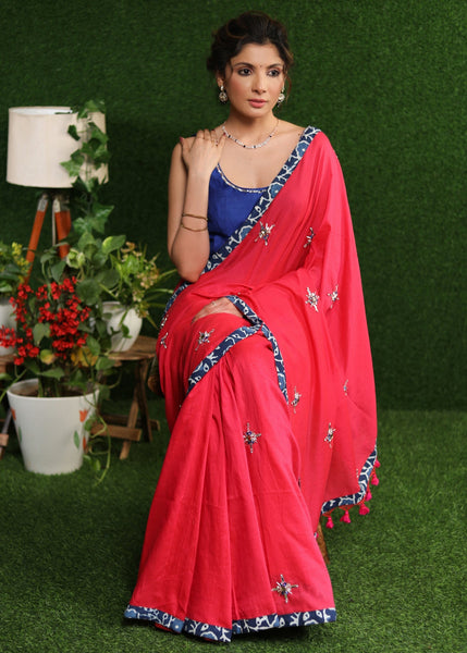 Graceful pink Cotton saree with silver stone embellishment and indigo border