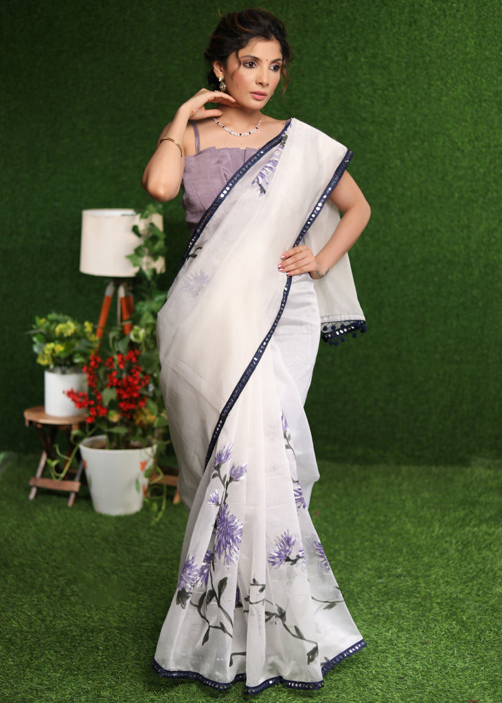 Designer white saree with lavender hand painting and Mirror work border
