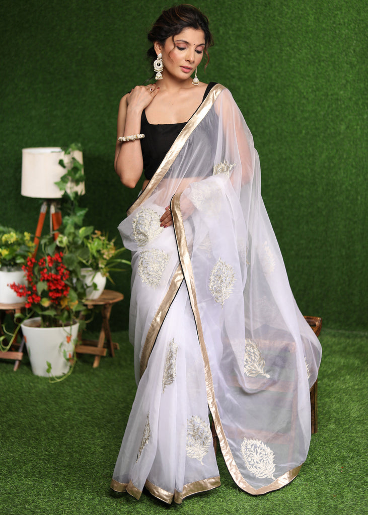 Beautiful white Organza saree with golden classy Zari embroidery & border