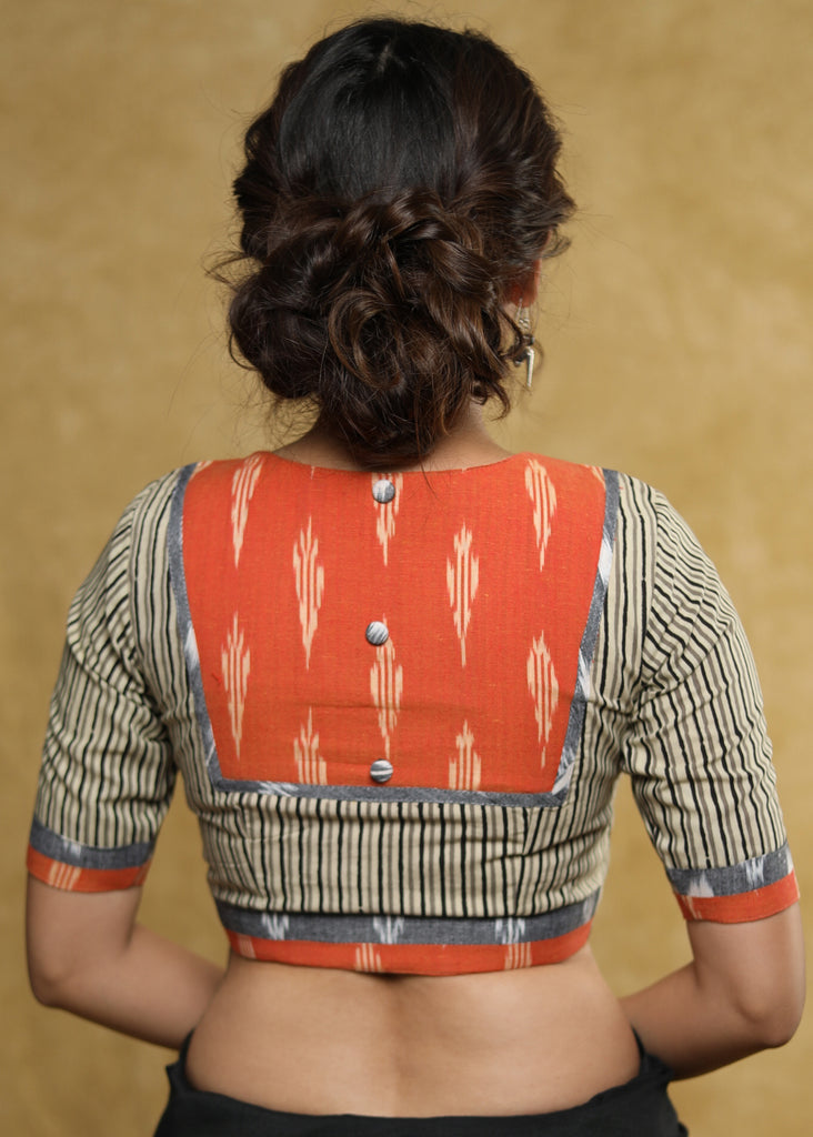 Classy grey stripped blouse with orange & grey Ikat detailing at the back