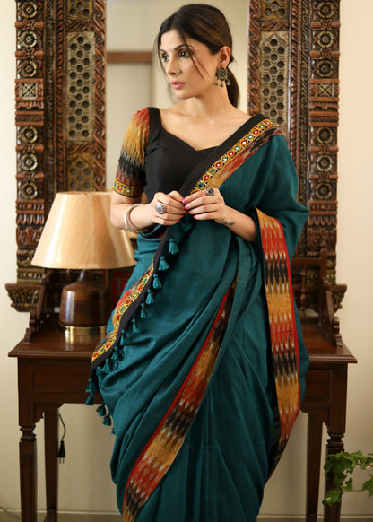 Comfortable peacock green Cotton saree with beautiful mirror work & Ikat border
