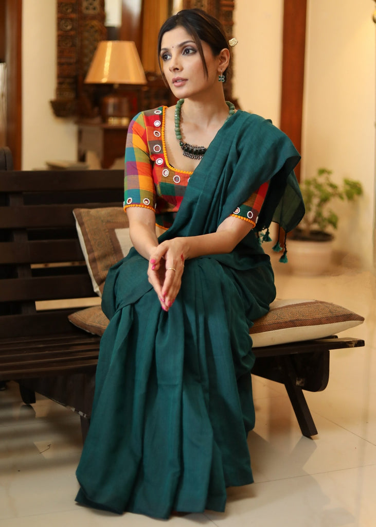Elegant plain peacock green cotton saree with multicolor blouse piece