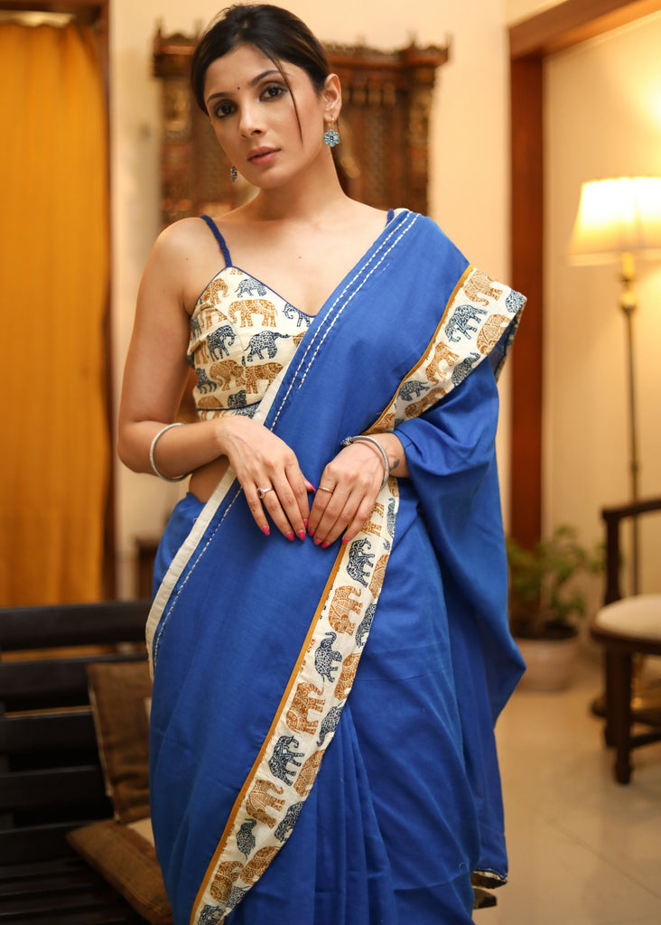 Bright blue Cotton saree with elephant print border and white lines
