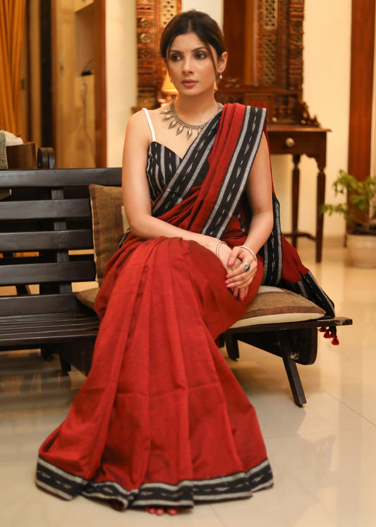 Breezy maroon plain Cotton saree with beautiful black Ikat border