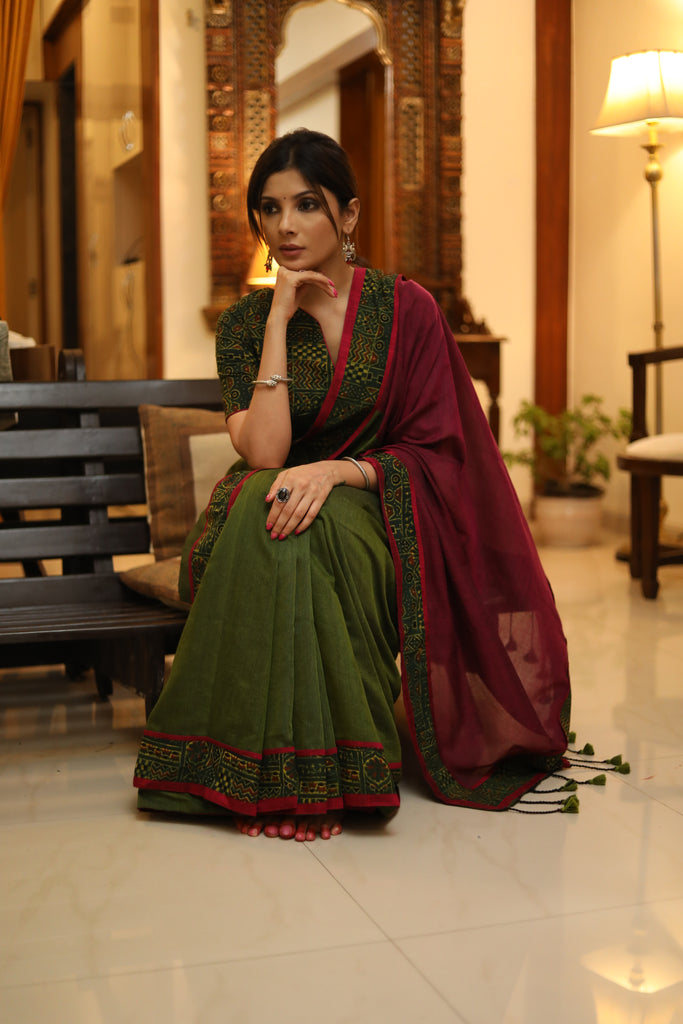 Versatile green and magenta combination Cotton saree with green Ajrakh border