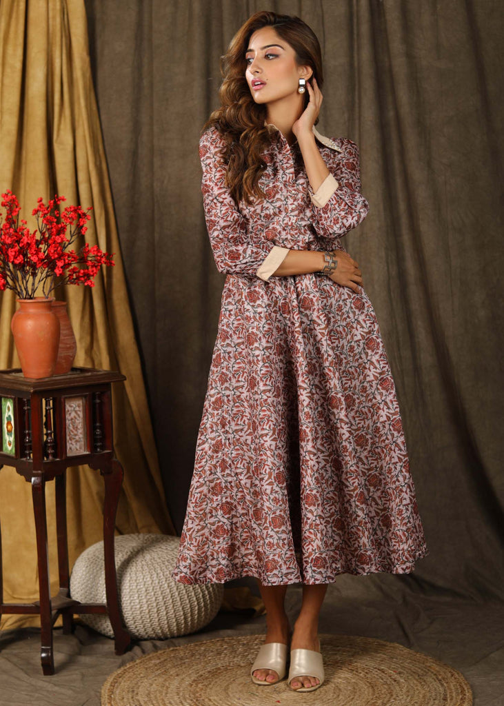 Trendy Kota silk collared dress with beautiful kalamkari print highlighted with pearl embellishments