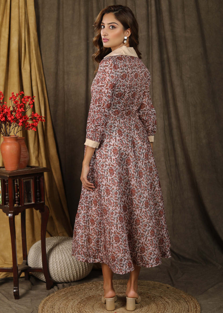 Trendy Kota silk collared dress with beautiful kalamkari print highlighted with pearl embellishments