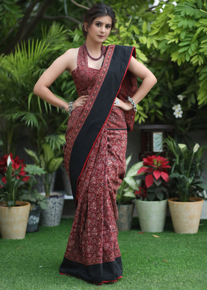 Dussehra Sale — Sensuous maroon Ajrakh saree with black border & Accentuated with stone embellishment.