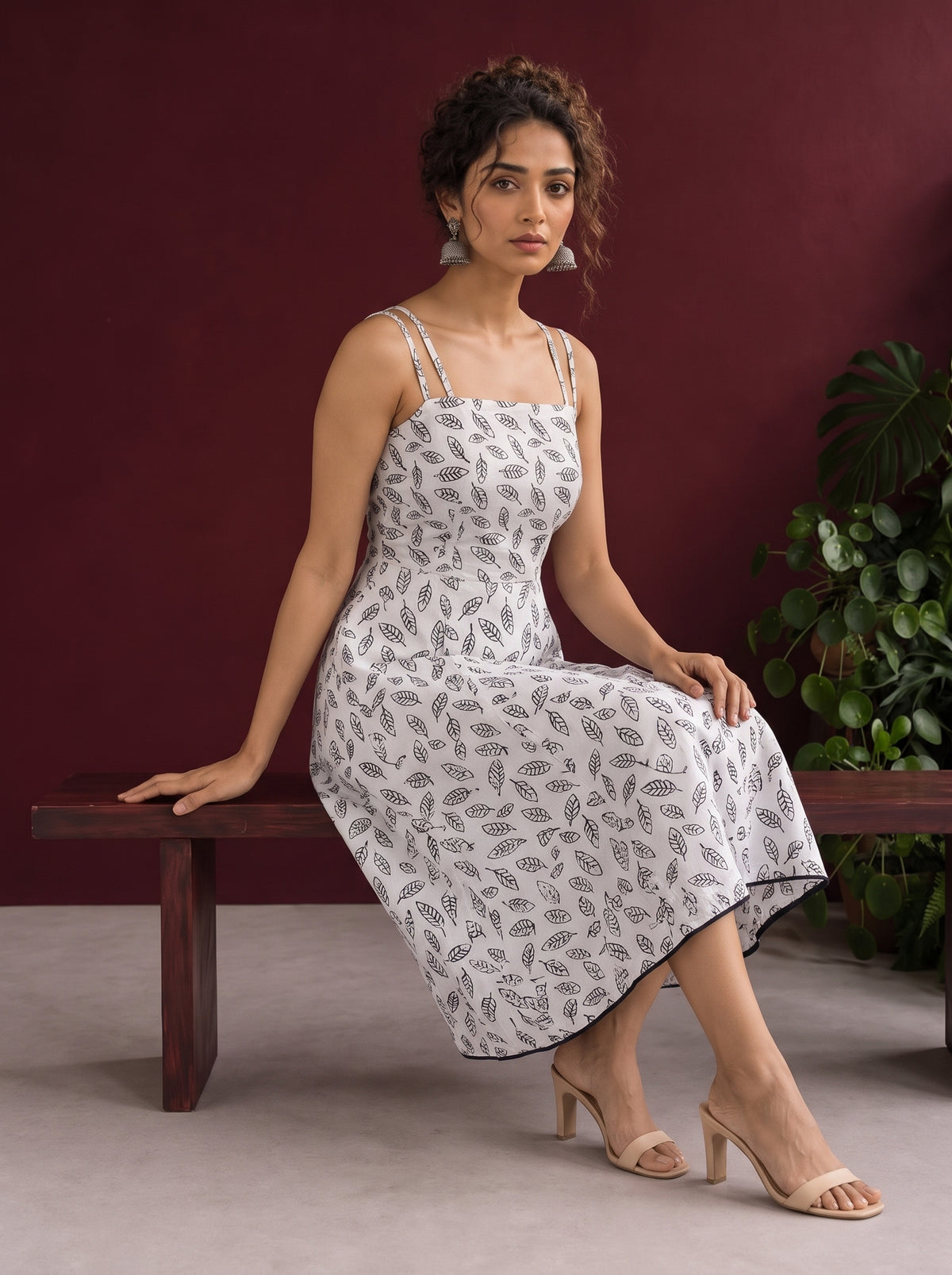 White Cotton Fit & Flare Midi Dress with Black Feather Print and Double Strap Detail — seated — view 2