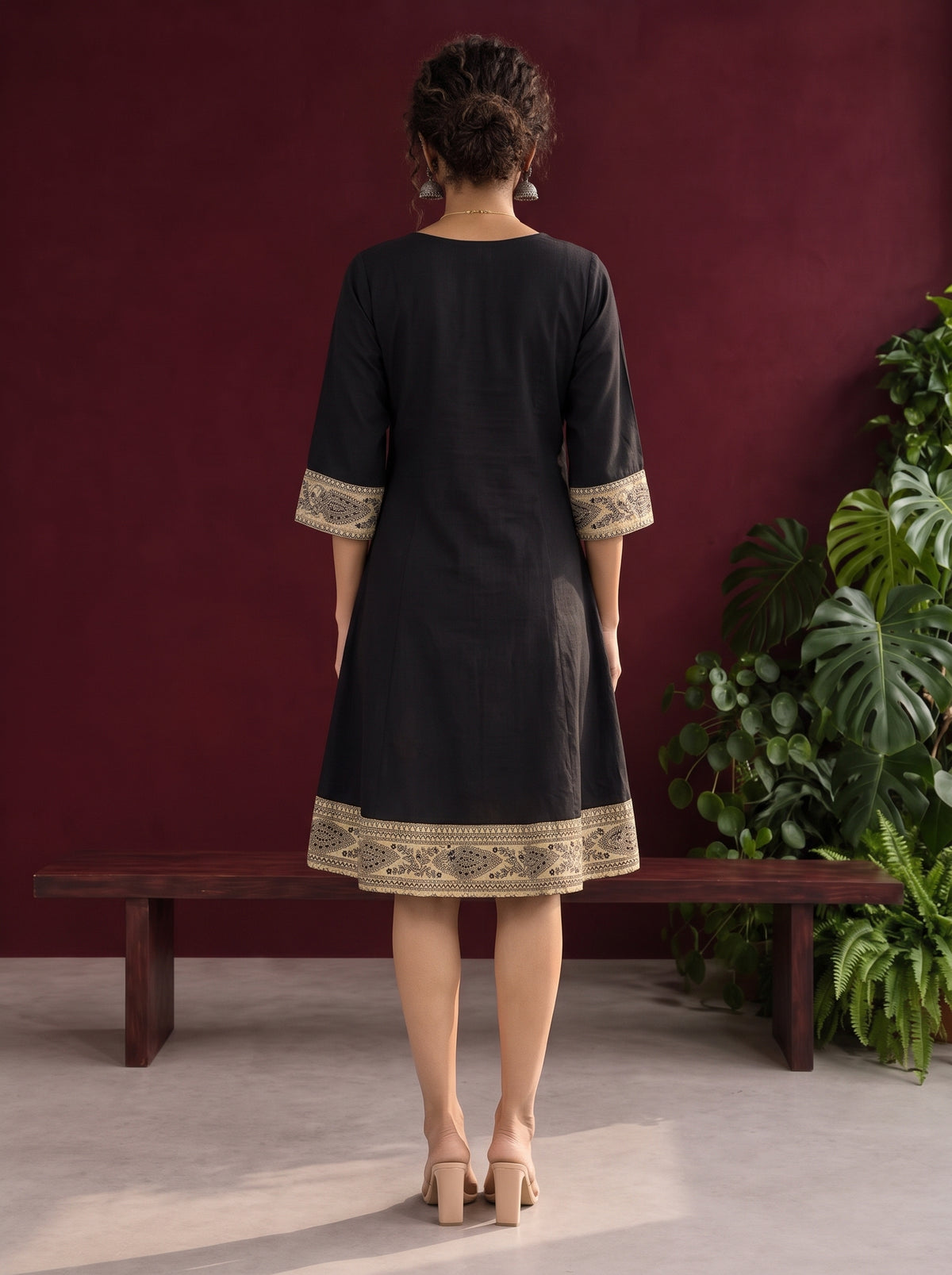 Elegant Black Cotton A-Line Dress with Madhubani Print Border Hem and Matching Bell Sleeve Cuffs — back view — view 6