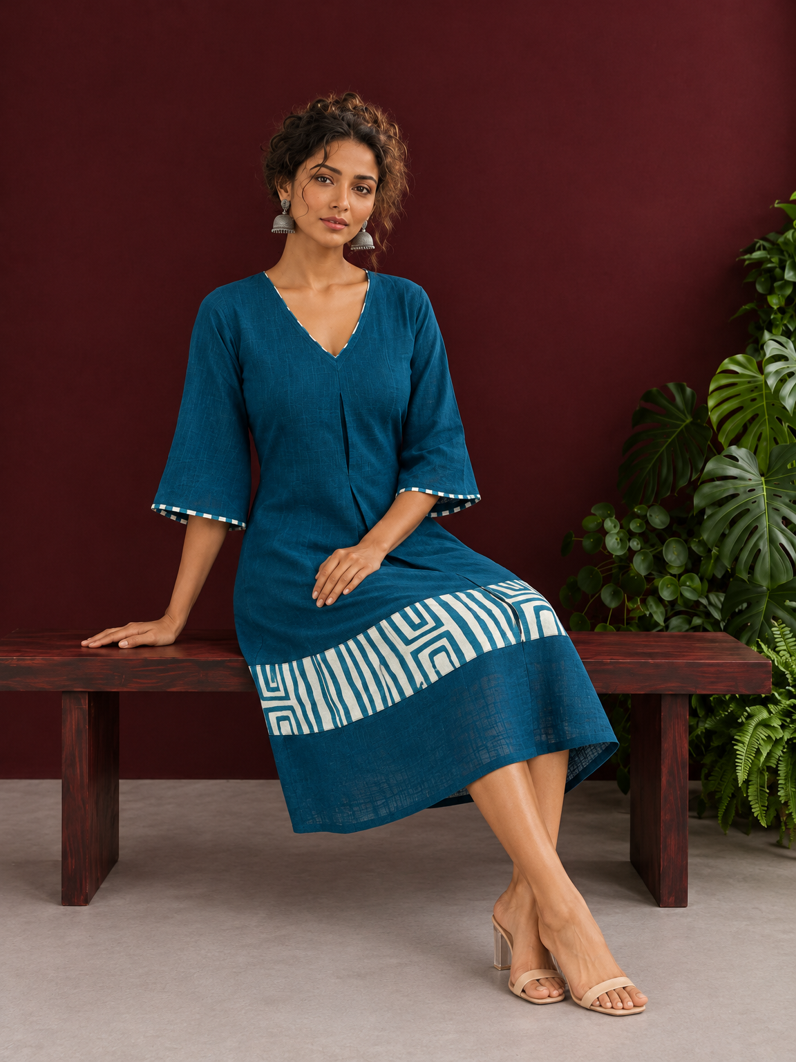 Teal Blue Cotton Dress with Abstract Print Hem Panel and Sleeve Cuffs — seated — view 2
