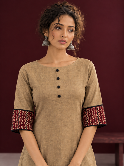 Timeless Beige Cotton A-Line Dress with Maroon Zigzag Print Sleeve Cuffs & Hem Border — fabric detail