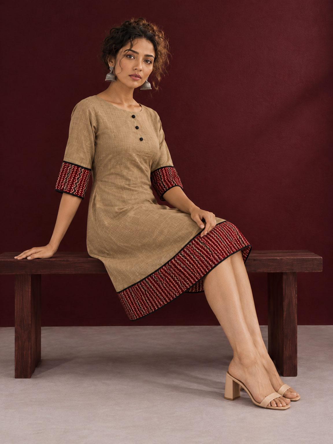 Timeless Beige Cotton A-Line Dress with Maroon Zigzag Print Sleeve Cuffs & Hem Border — seated
